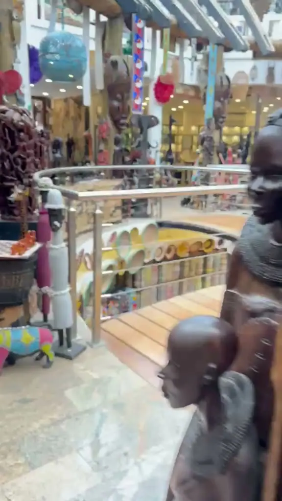 The atrium of the Cultural Heritage Centre, carvings along the balcony and baskets and lanterns on the floor below